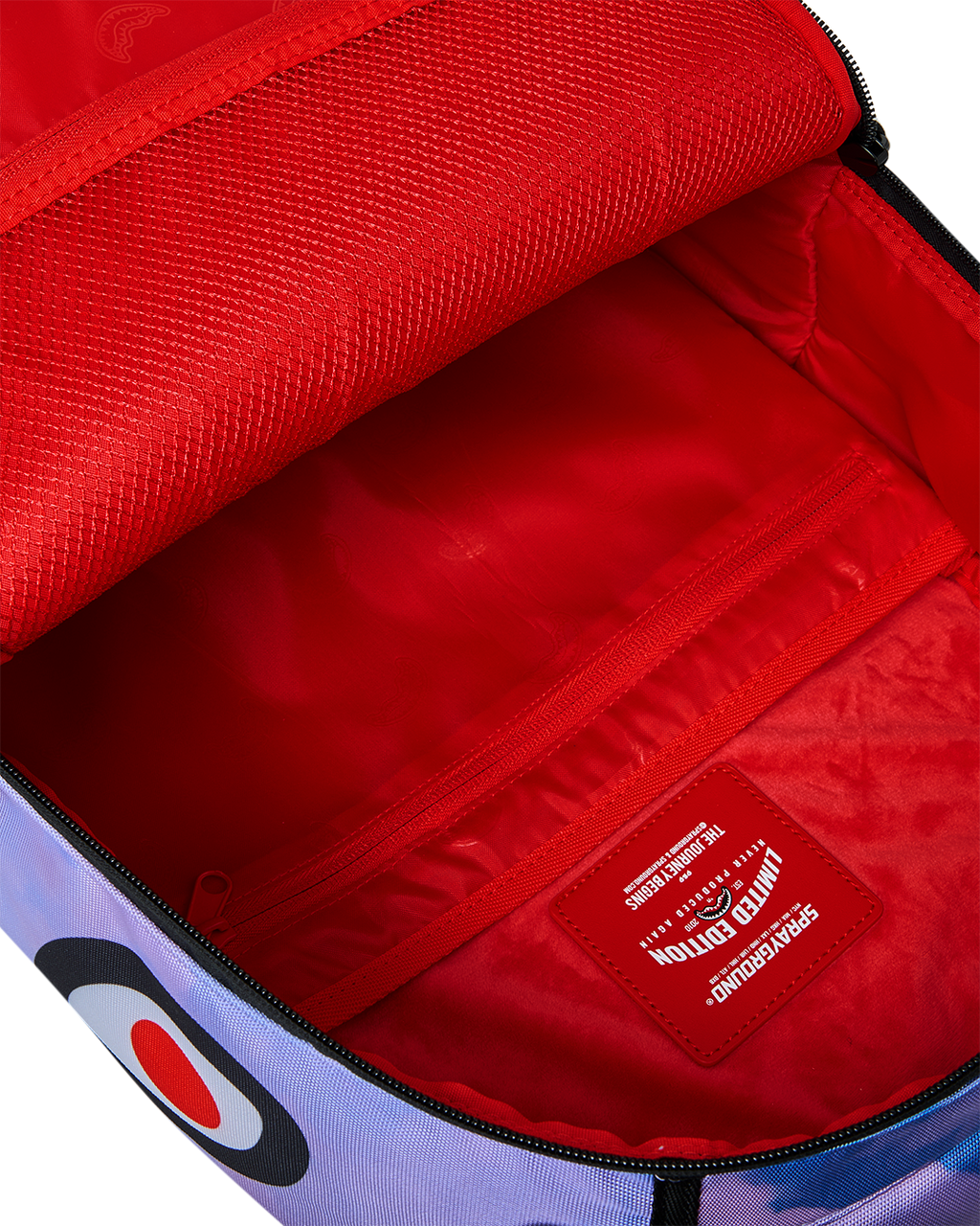 Sprayground Cloudbreaker backpack open with red lining and zippered interior pocket