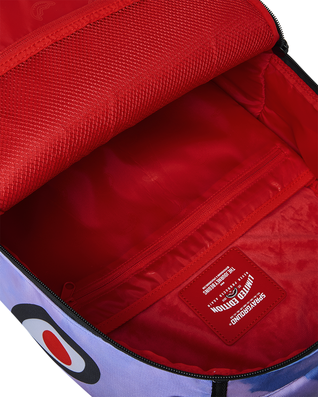 Sprayground Cloudbreaker backpack open with red lining and zippered interior pocket