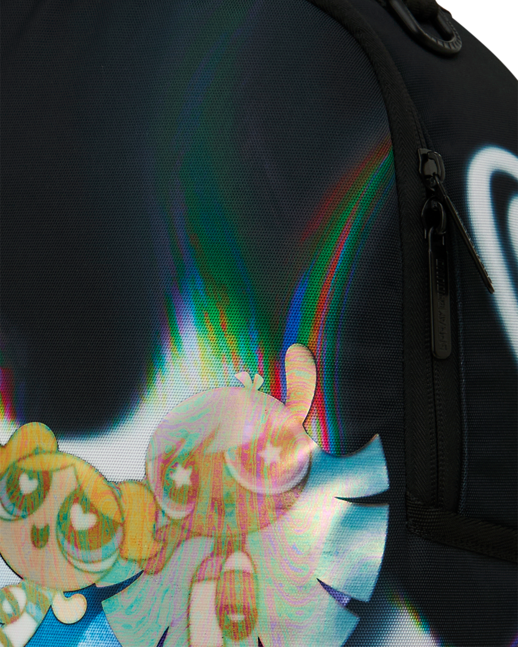 Sprayground Power Flex backpack close-up of character graphic on black fabric and zipper