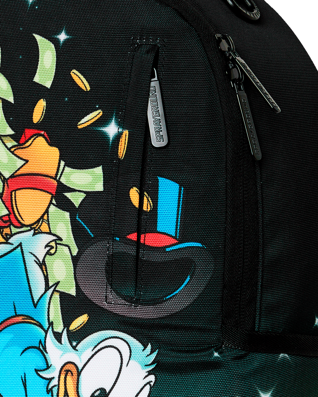 Sprayground Money Rider backpack bag close-up of black zipper pull and character fabric print