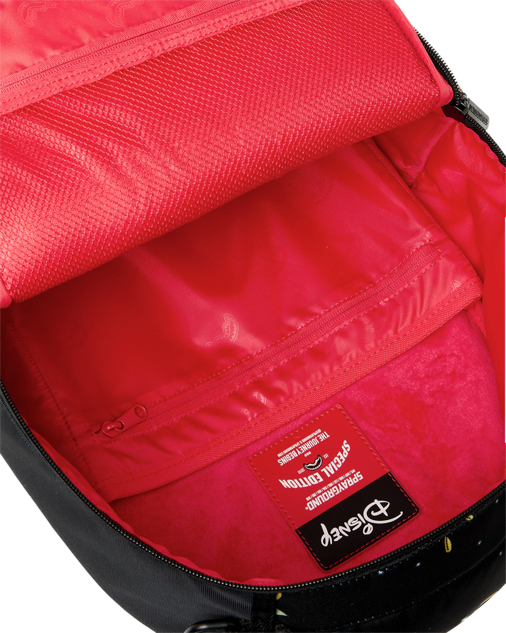 Sprayground Money Rider backpack bag interior with red lining and branded fabric label