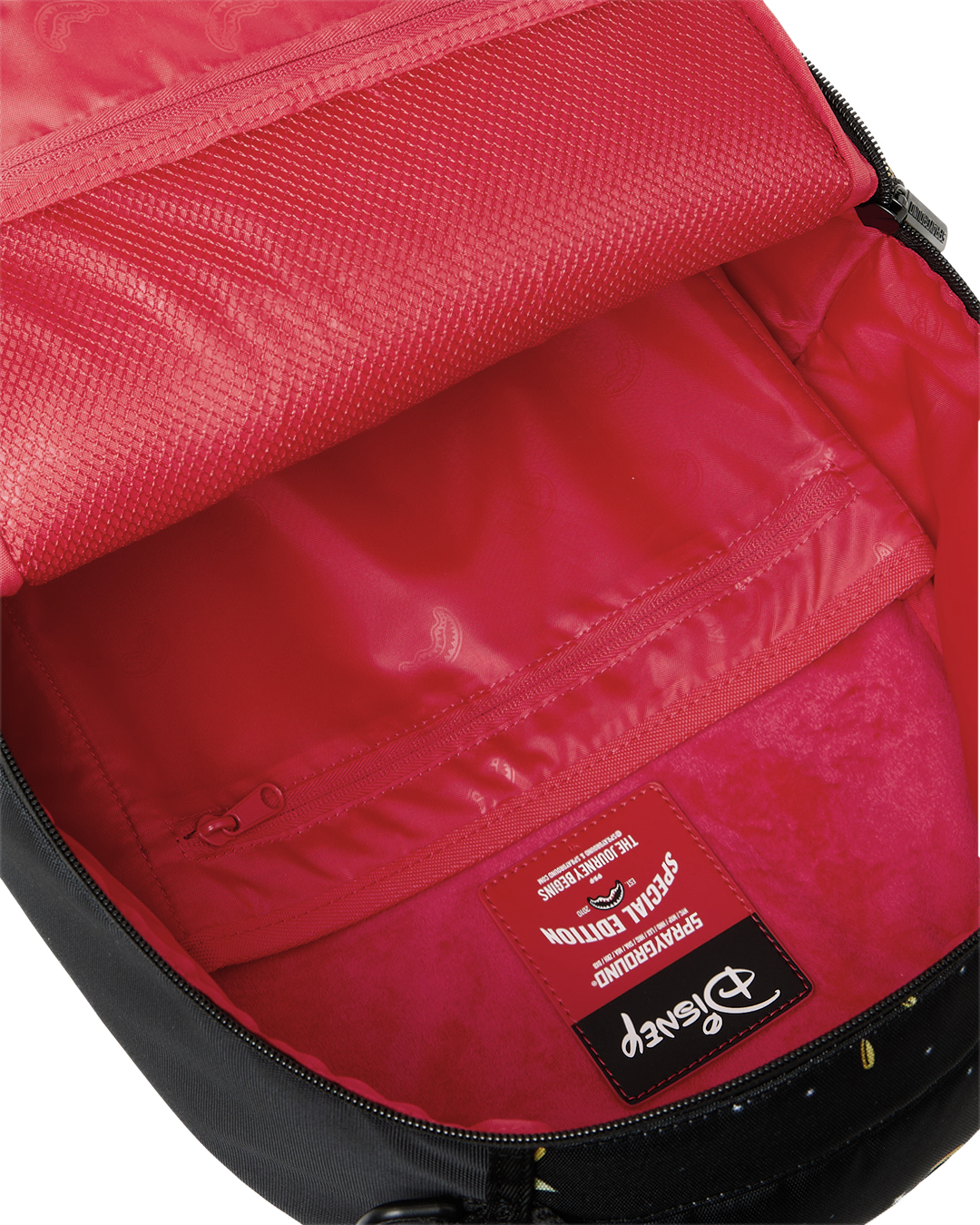 Sprayground Money Rider backpack bag interior with red lining and branded fabric label