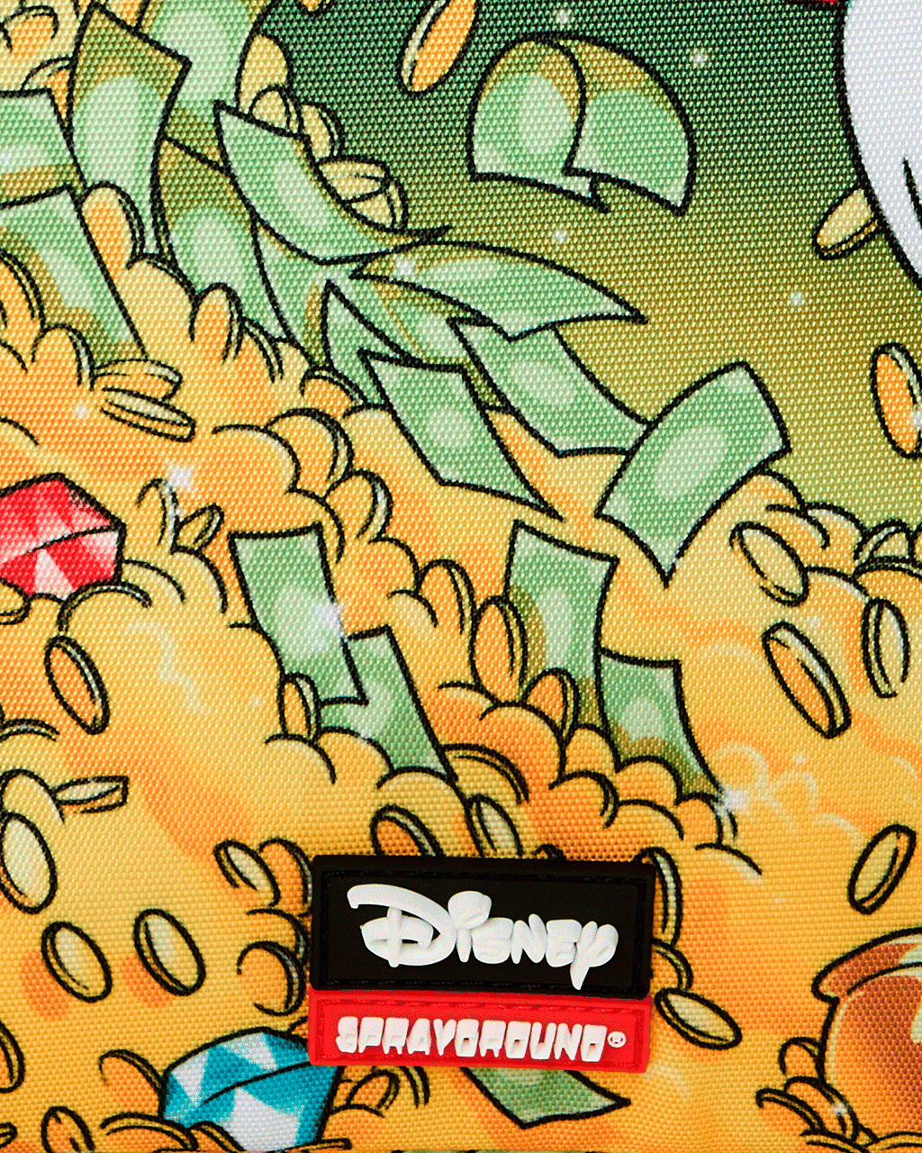 Sprayground Money Rider backpack bag close-up of Disney patch on colorful Scrooge print fabric