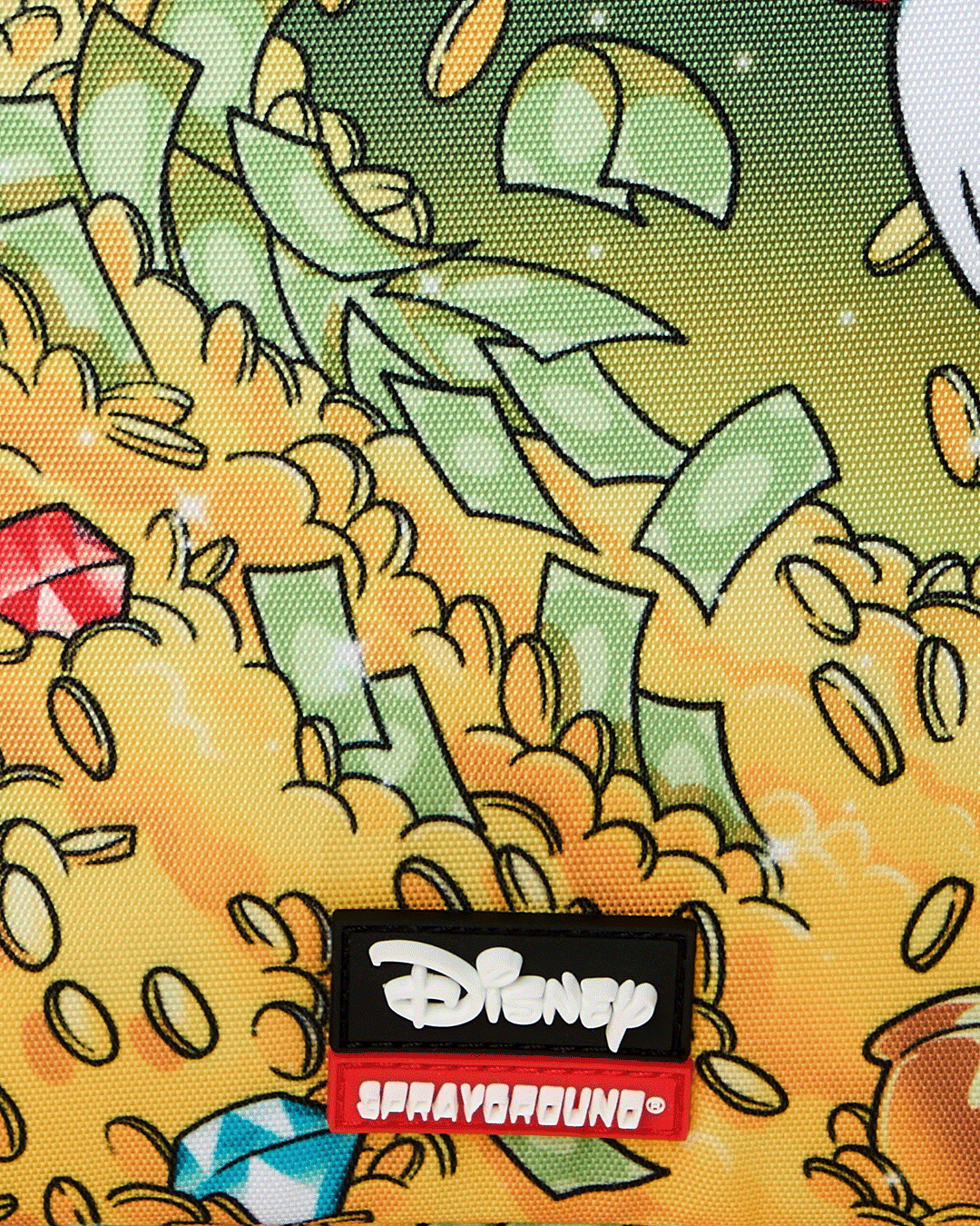 Sprayground Money Rider backpack bag close-up of Disney patch on colorful Scrooge print fabric