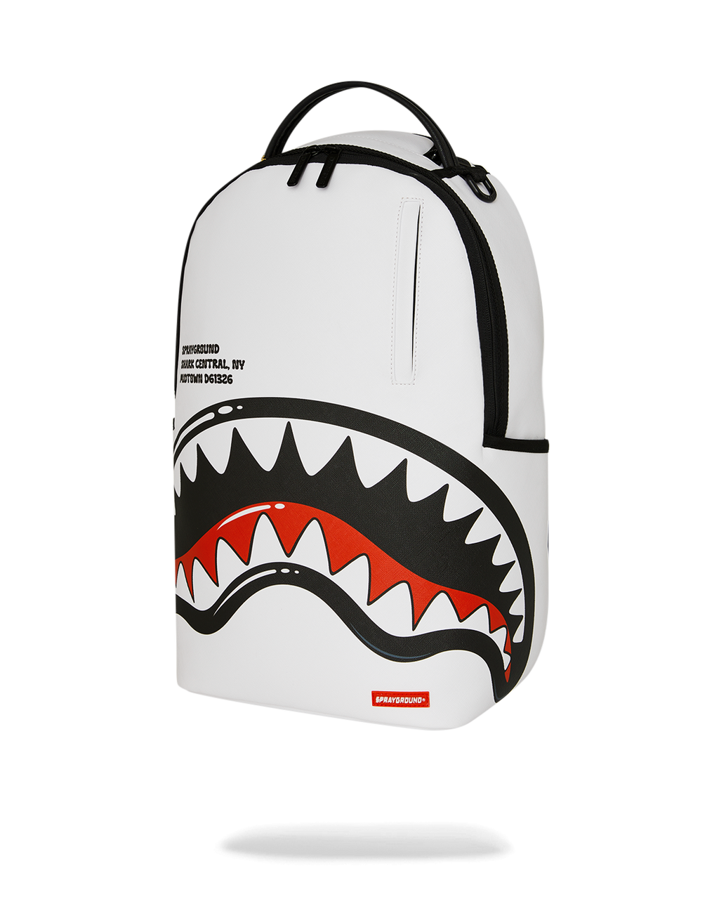 White backpack with central shark graphic, black curved trim, and top zip tab