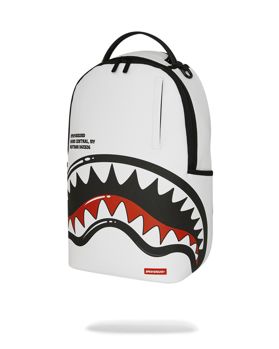 White backpack with central shark graphic, black curved trim, and top zip tab