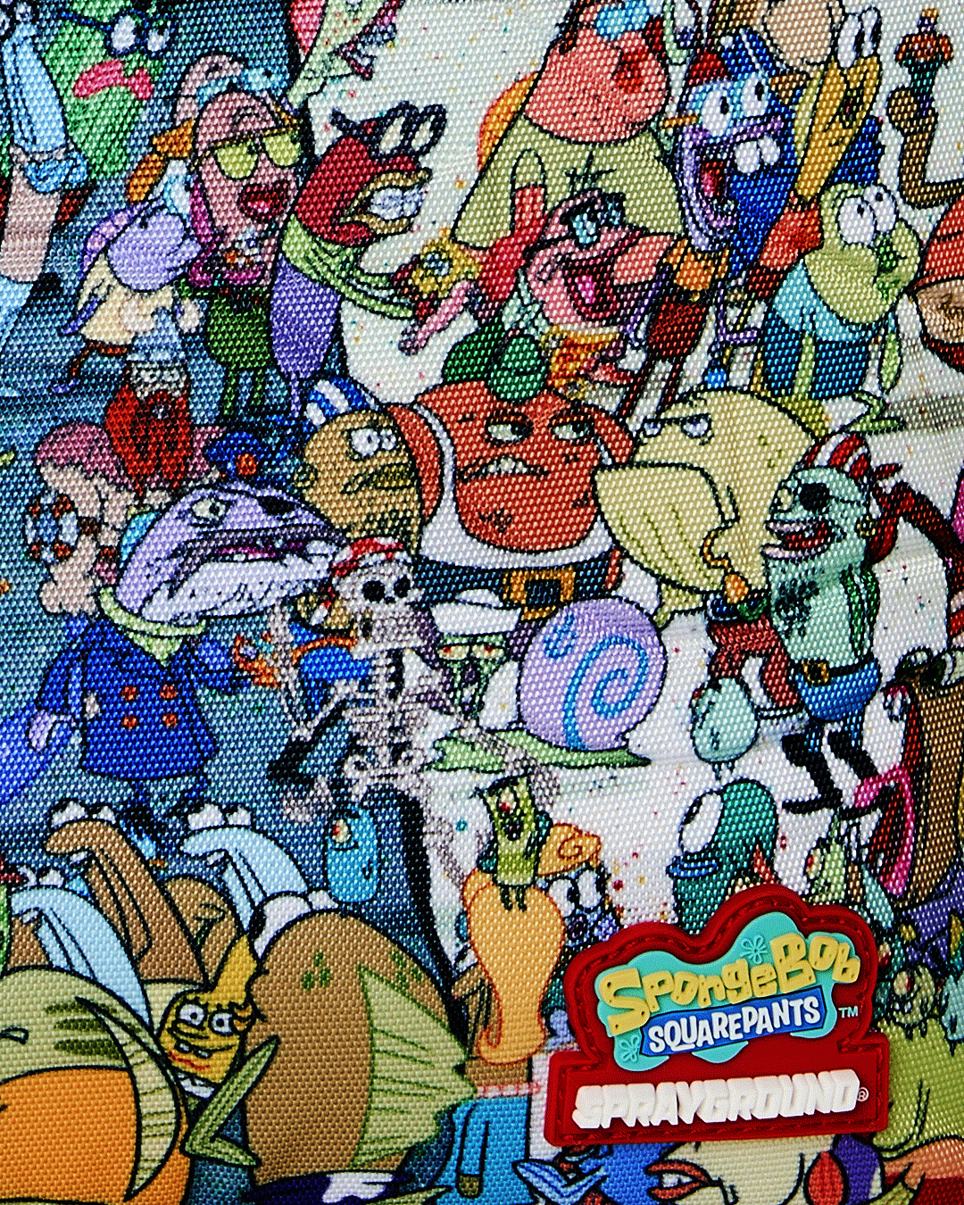 Close-up of SpongeBob backpack fabric print with colorful characters and ocean scene