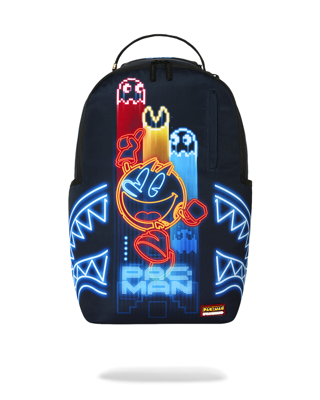 Sprayground Pac-Man Eat Em Up backpack with glowing arcade characters on navy fabric