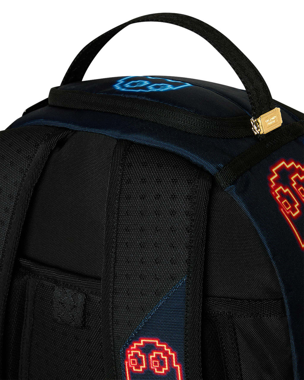 Pac-Man-themed backpack front top area with handle and red/blue pixel icons