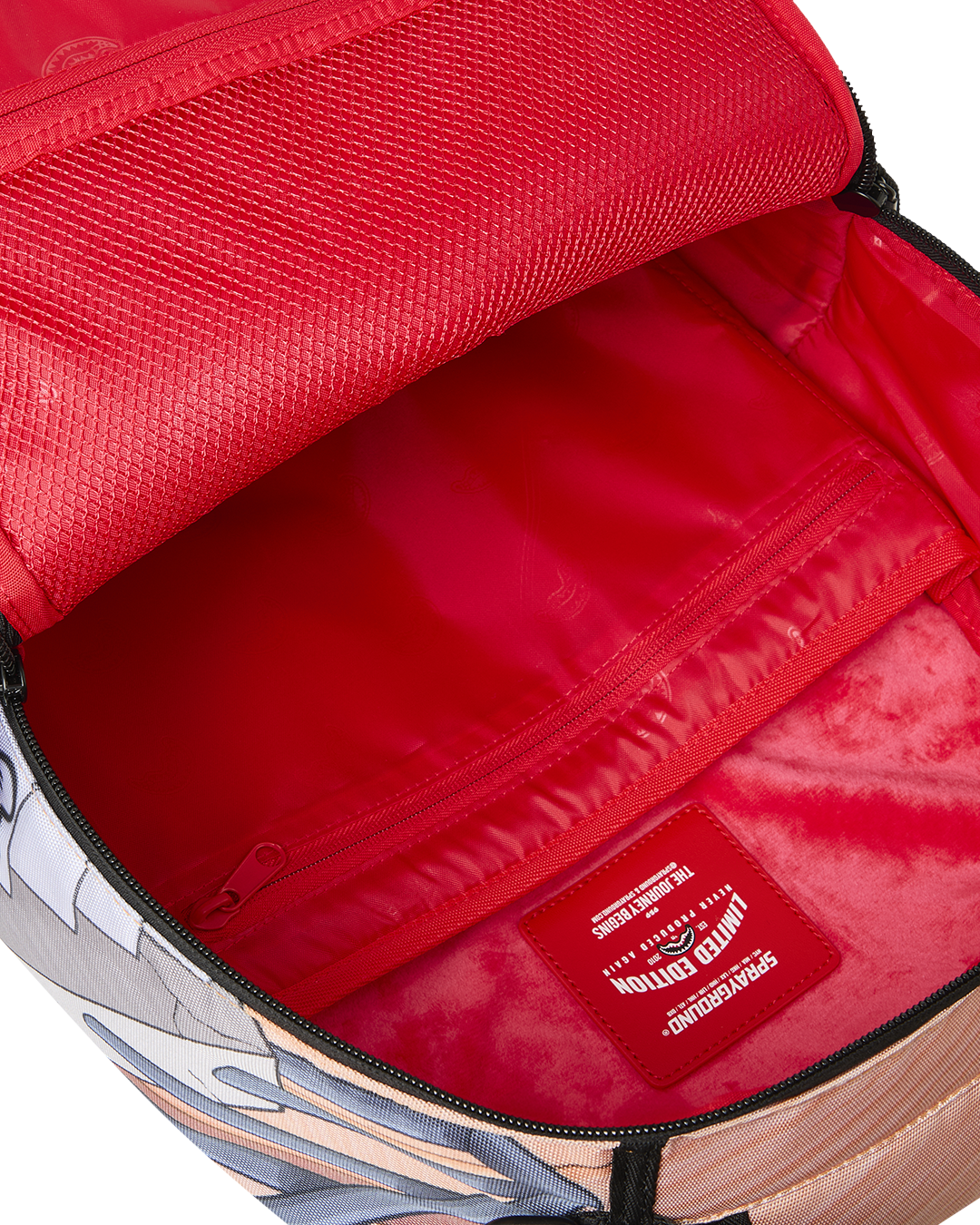 Kids backpack open interior with red lining and zippered pocket