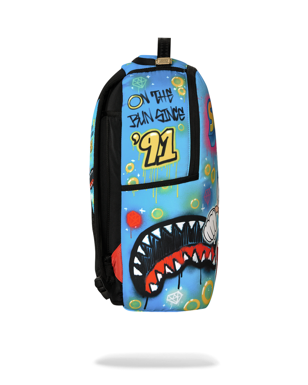 Blue and black Sonic-themed backpack back view with “01” patch and colorful print