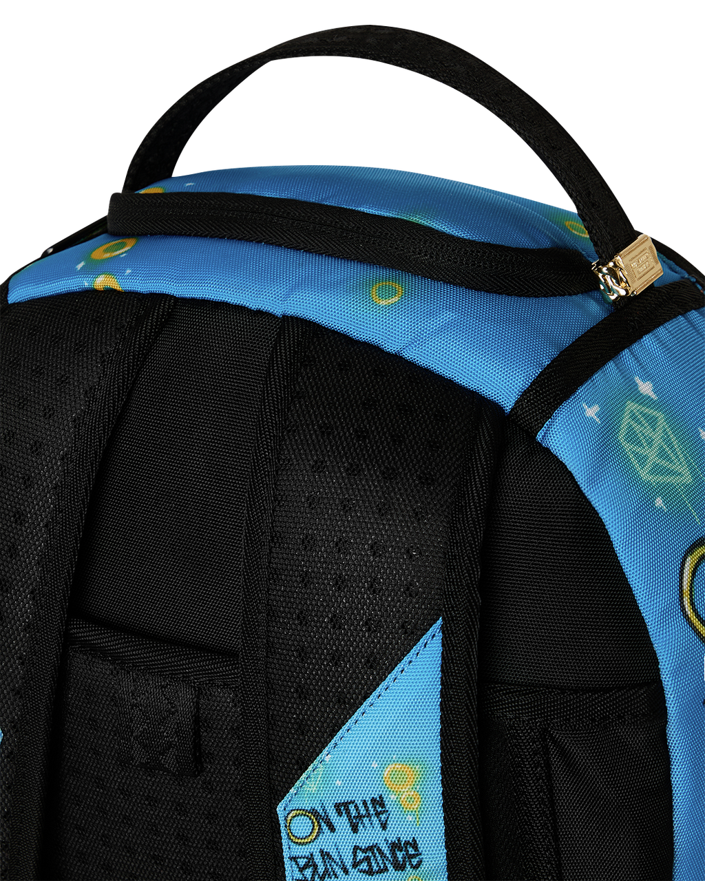 Top corner of blue backpack with black shoulder straps and woven loop handle