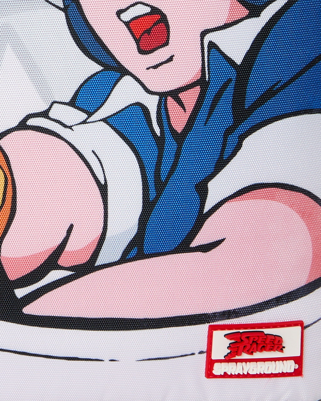 Close-up of cartoon character print and red-and-white “Sprayground” patch