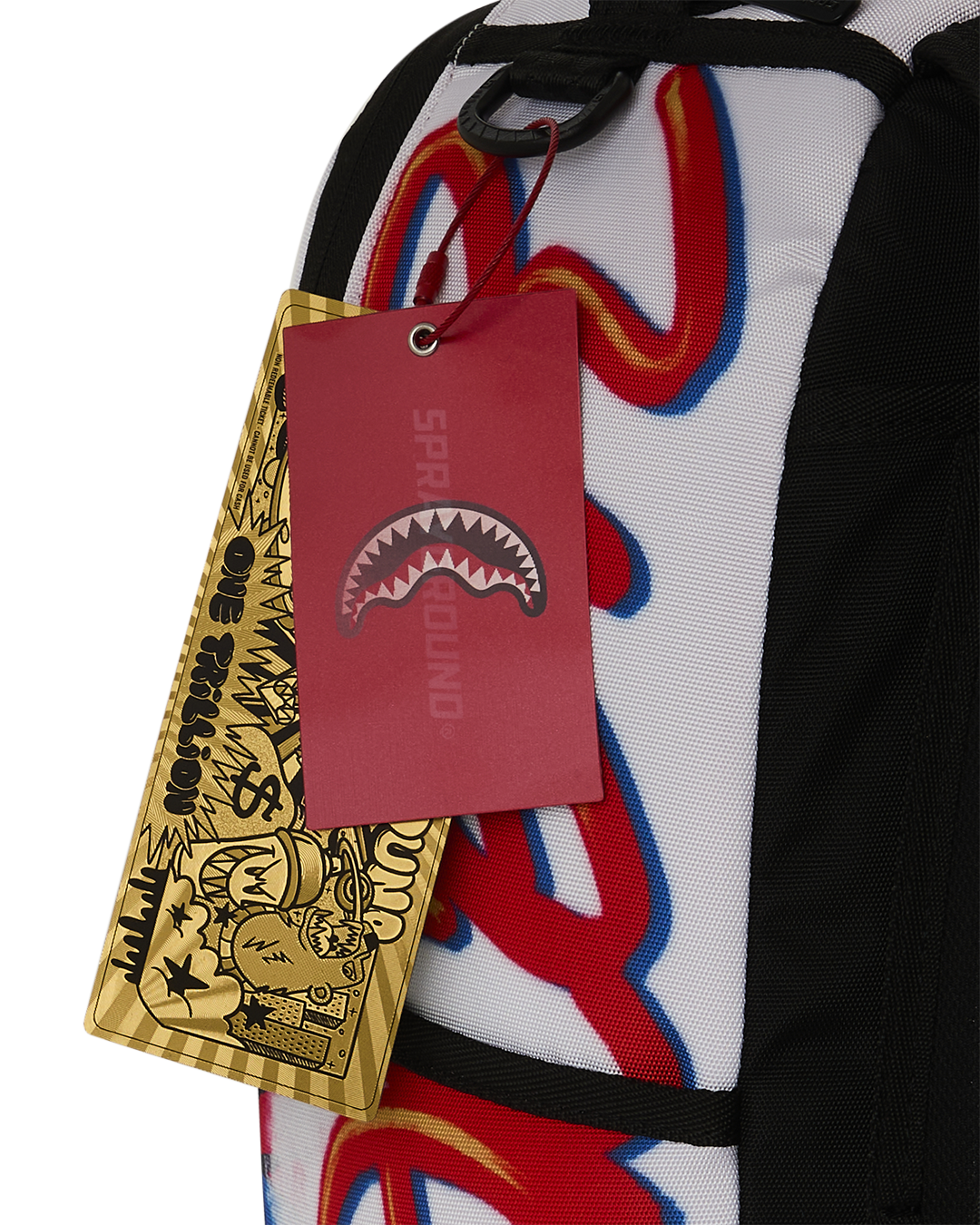 Mini backpack with hanging brand tags over black-and-white Speed Racer graphic