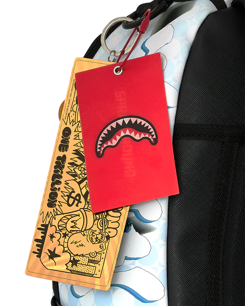Hang tags and keychain on black strap of blue character backpack