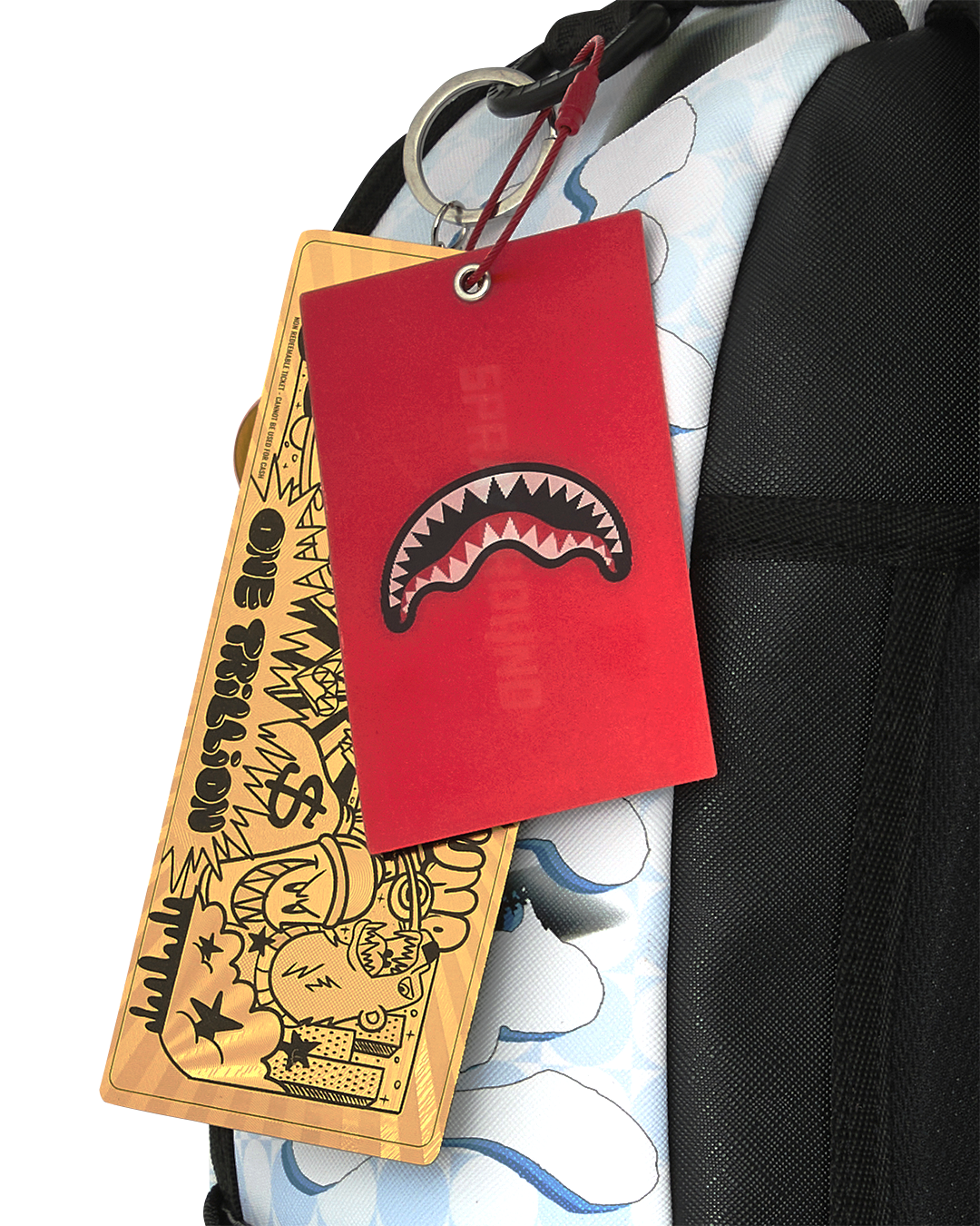 Hang tags and keychain on black strap of blue character backpack