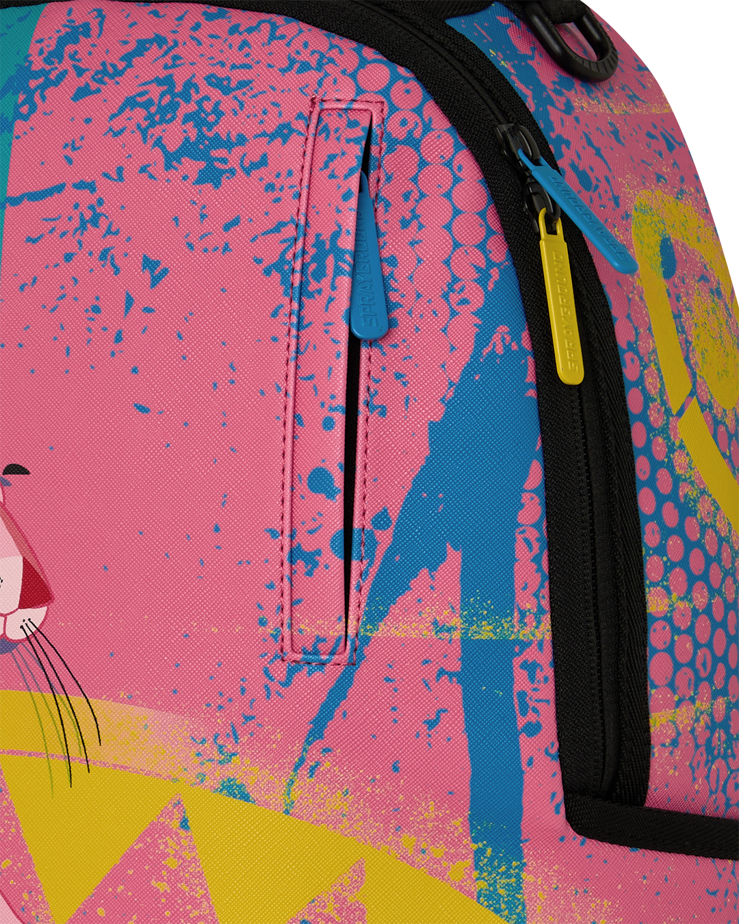 Close-up of art-print backpack fabric with blue zipper pull and pink textured pattern