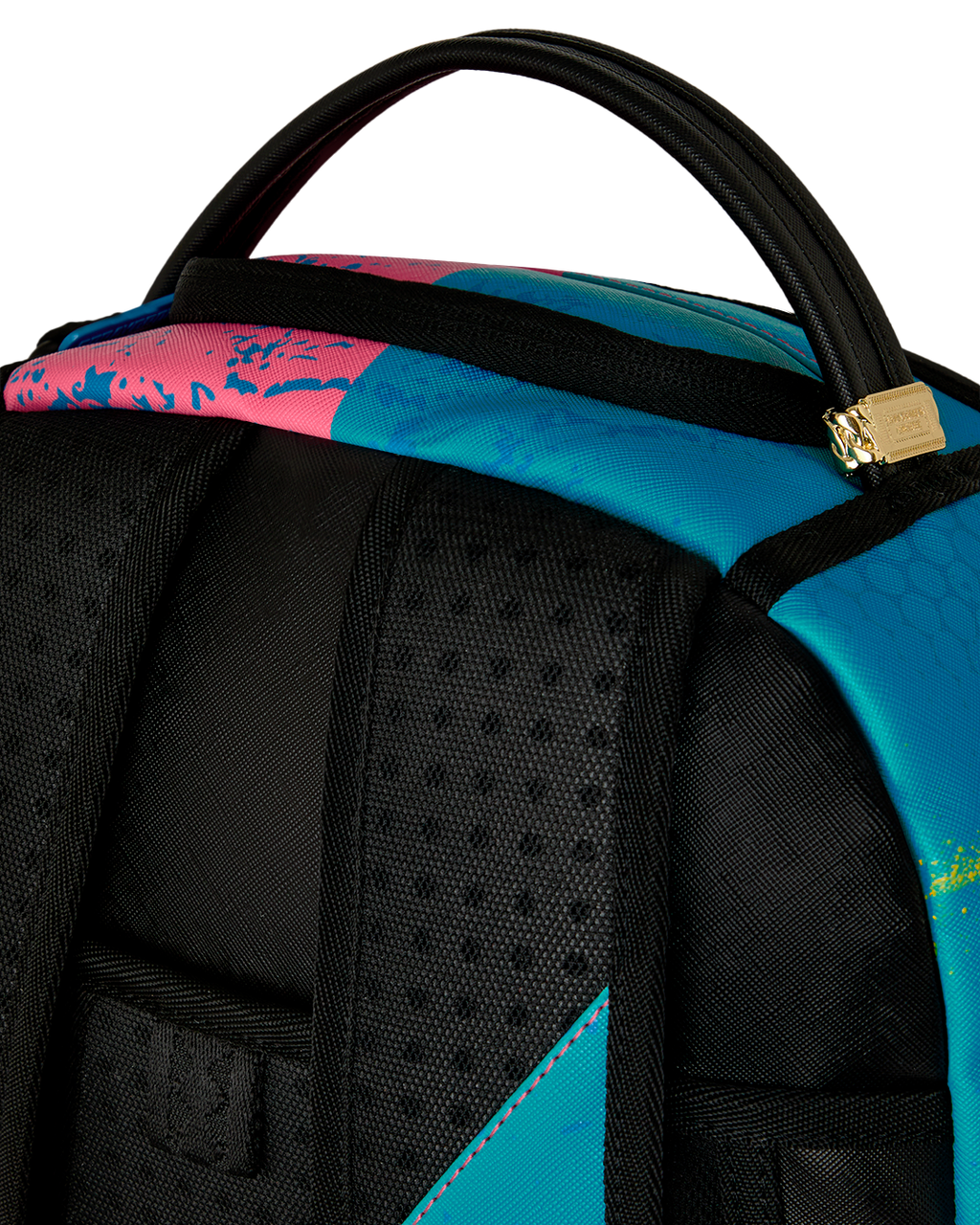 Close-up of top handle and black padded front section on colorful art-print backpack