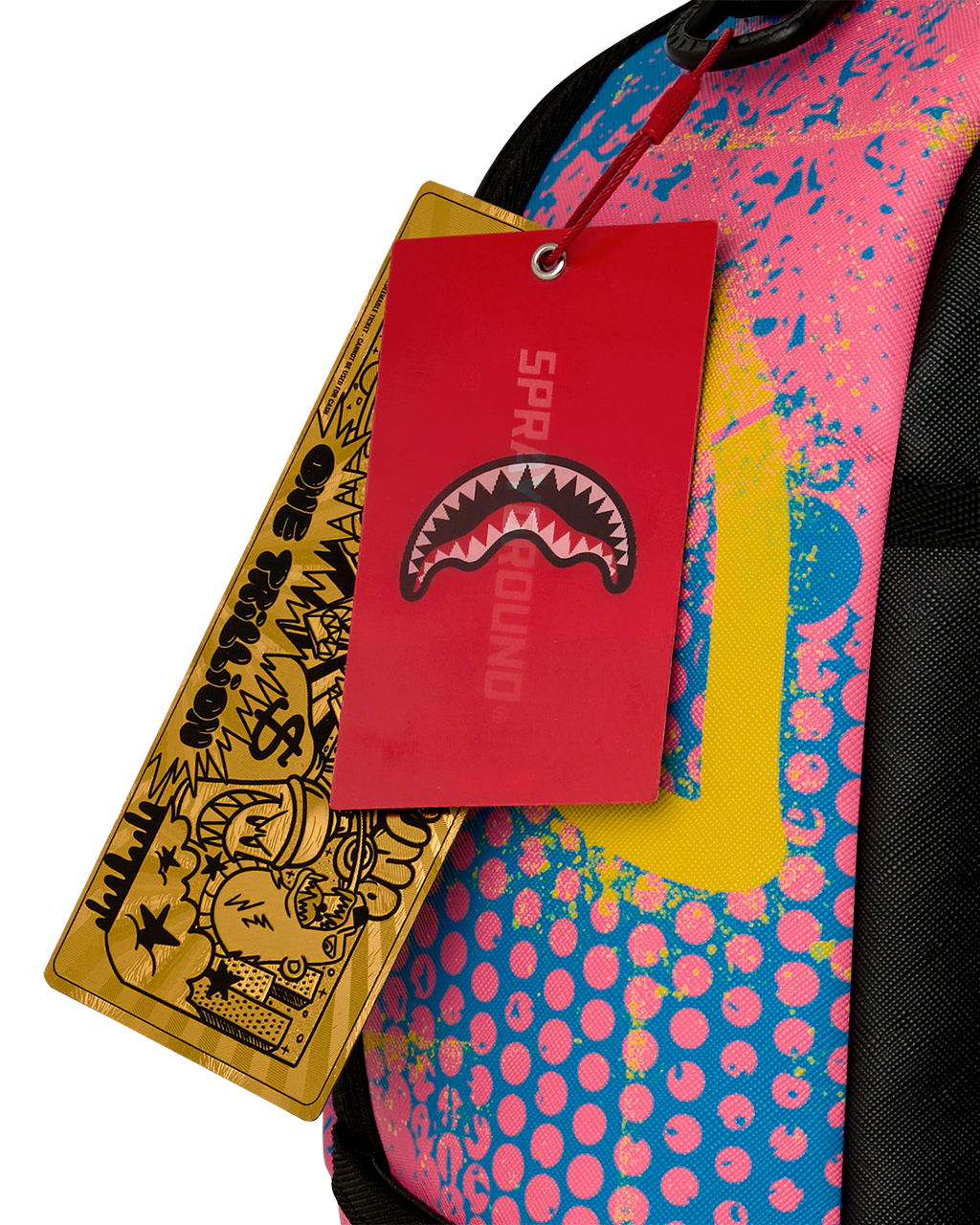 Backpack with hanging retail tags attached to the zipper pull