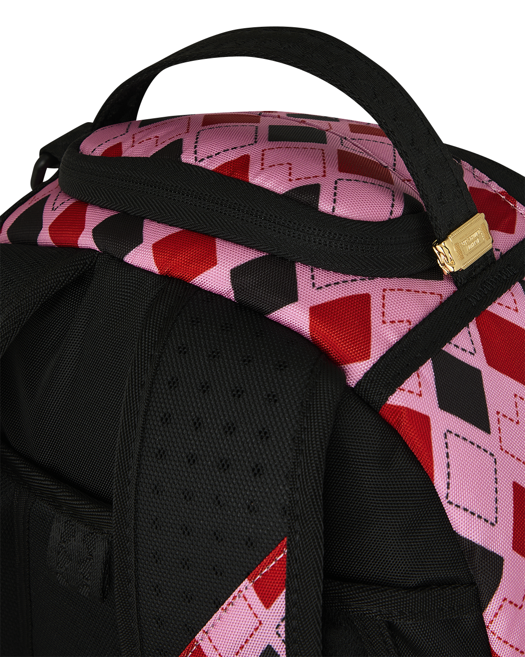 Harley Quinn backpack top and shoulder strap with black webbing and adjustable buckle.