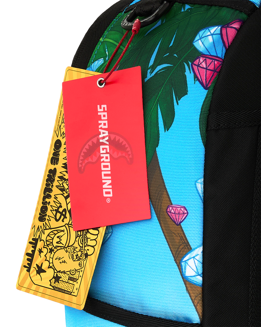 Backpack with hanging red and yellow tags and printed jungle leaf design