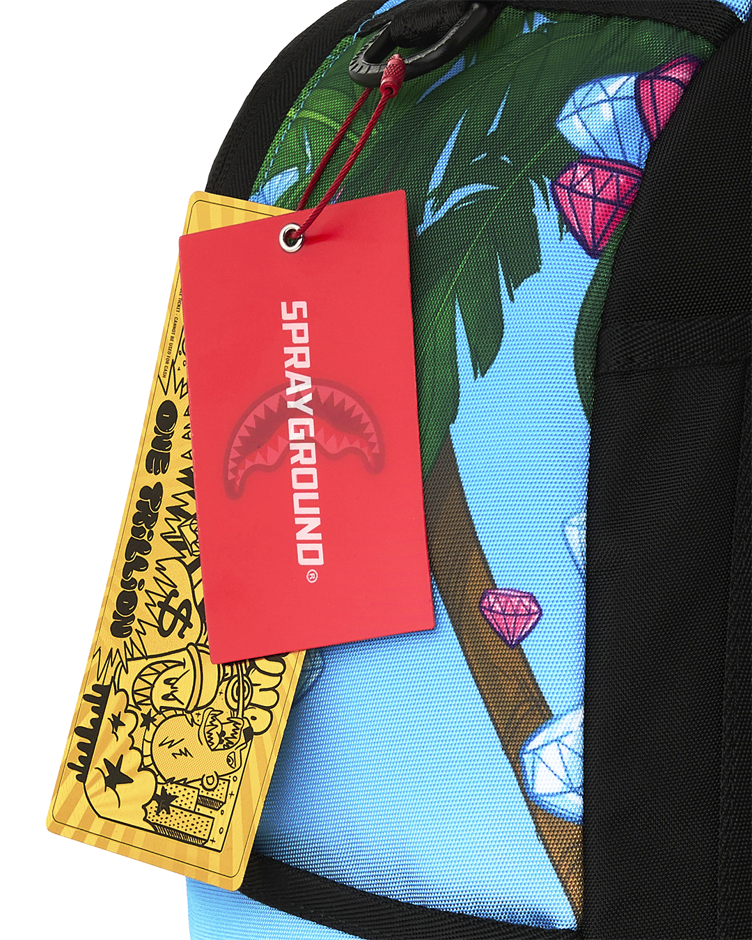 Backpack with hanging red and yellow tags and printed jungle leaf design