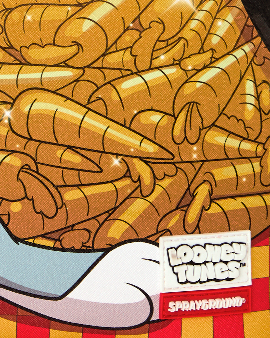 Close-up of carrot stack print fabric with Loonie Tunes and Sprayground labels