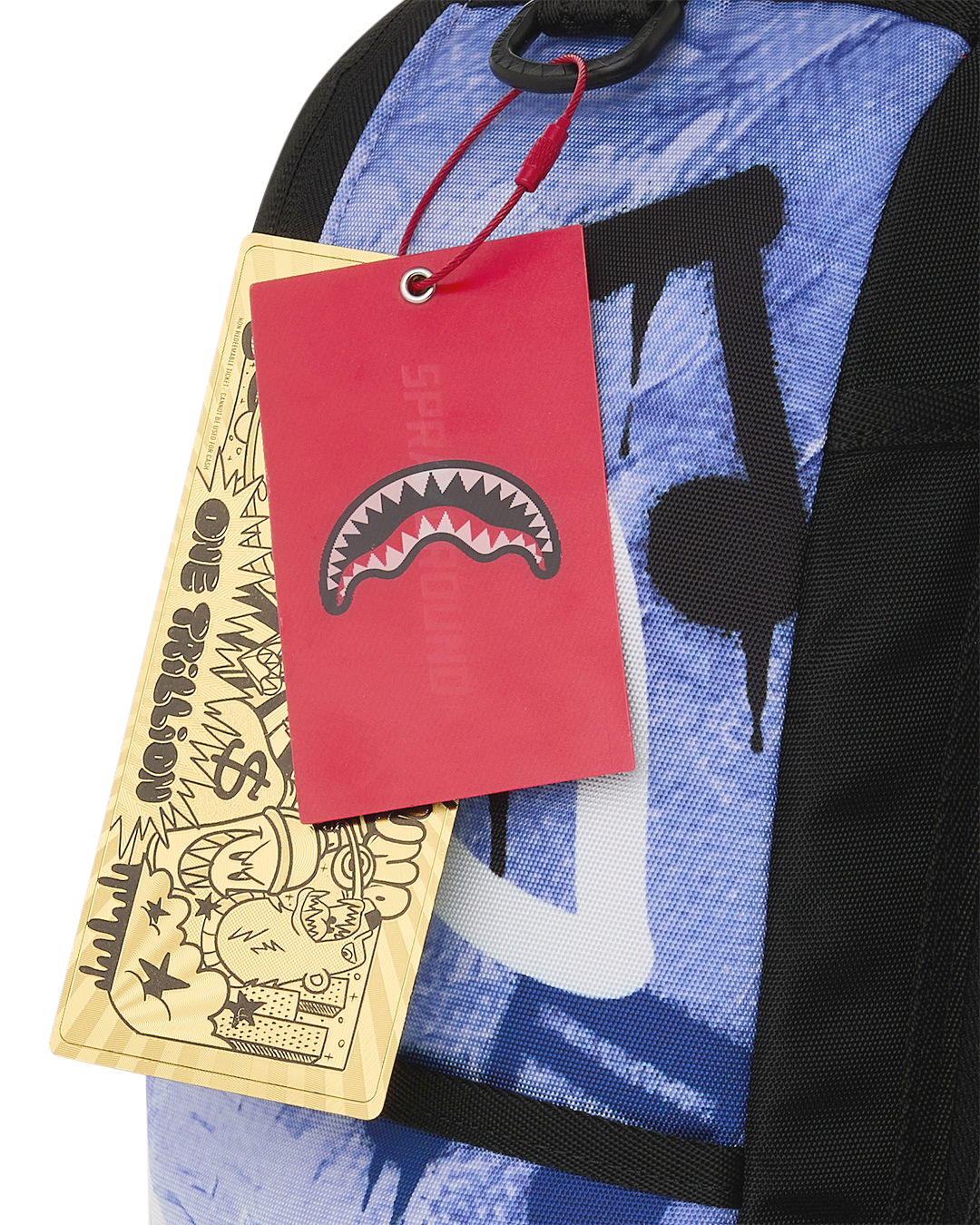 Kids backpack with red and tan hang tags attached near the shoulder strap