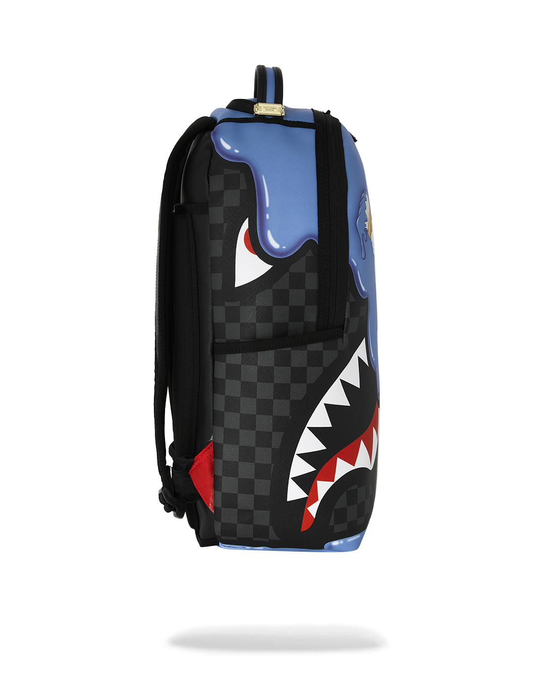 Blue backpack with black sides, white/red jagged print, and checkered panels