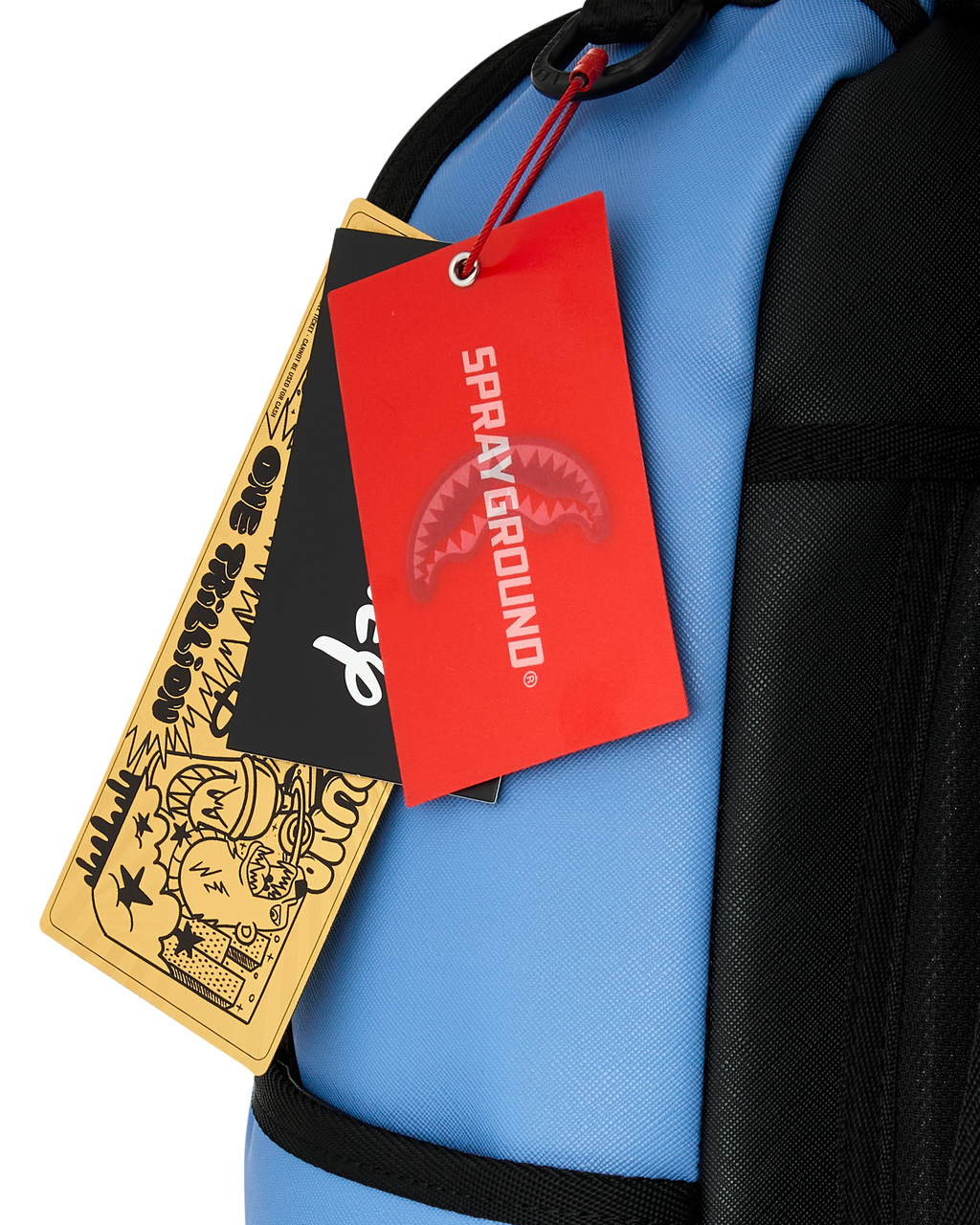 Blue backpack with red and gold hanging product tags attached near strap
