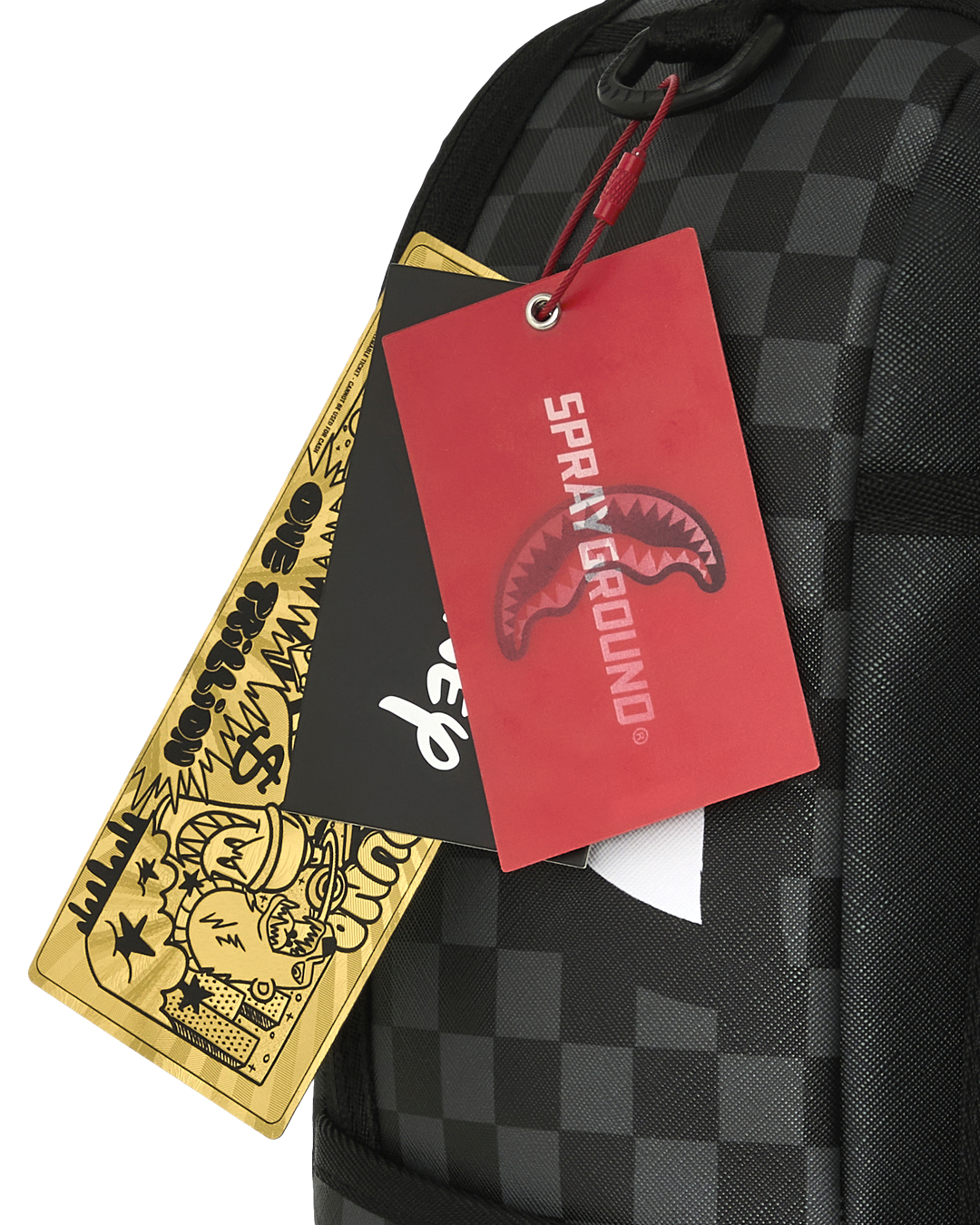 Backpack with two hanging red and gold brand tags on black checker fabric