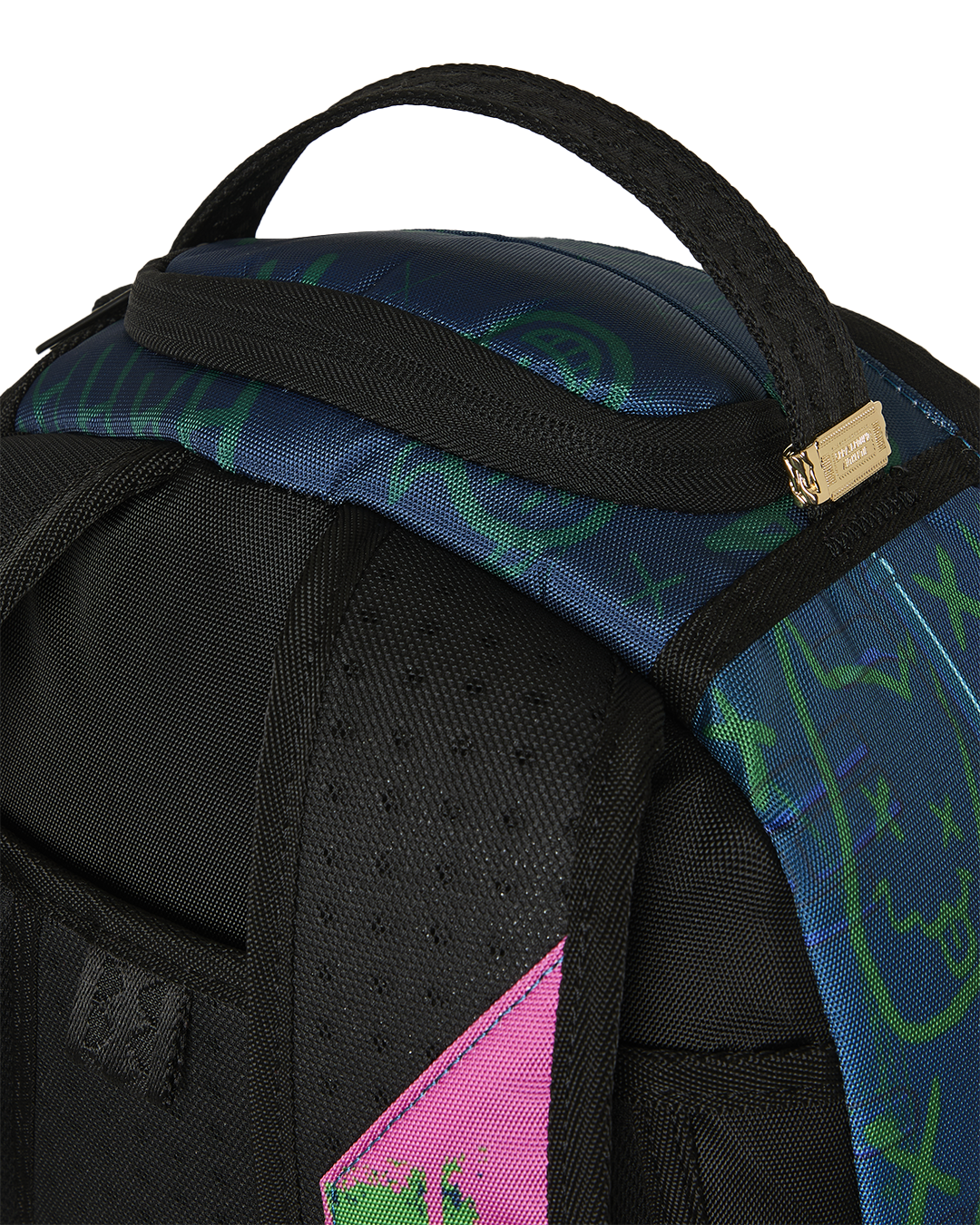 Mini backpack close-up of black strap, neon pattern panel, and stitched seams