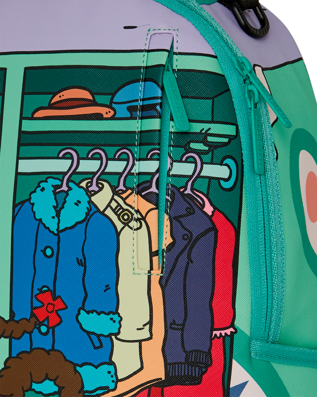 Mini backpack side close-up with green zipper and clothing artwork on panel