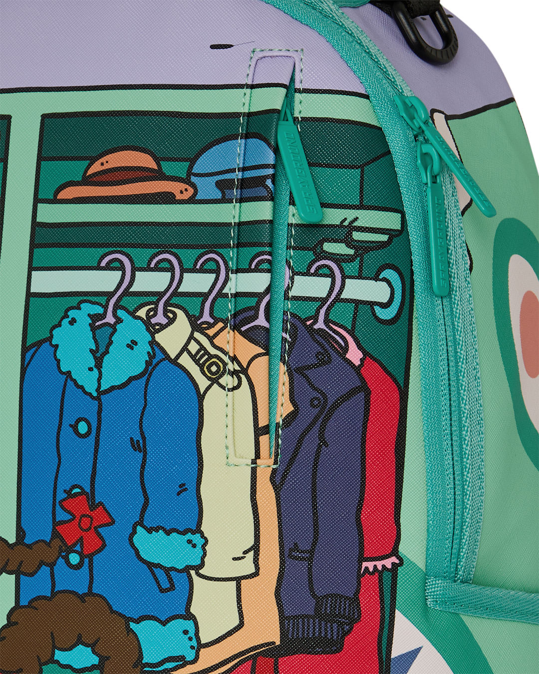 Mini backpack side close-up with green zipper and clothing artwork on panel