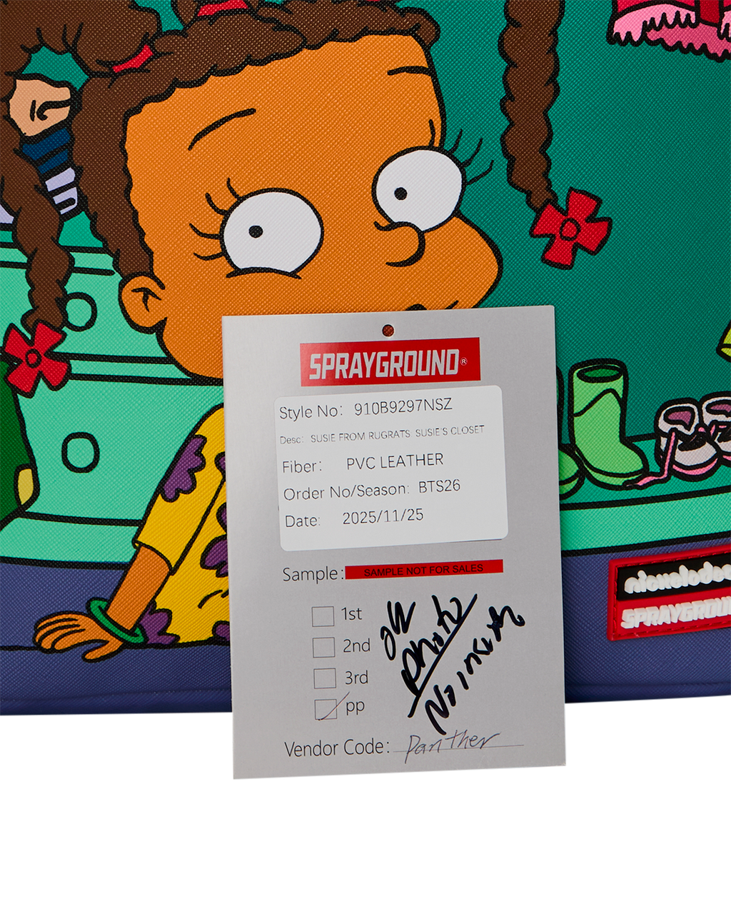 Sprayground product label card on mini backpack with fabric and style details