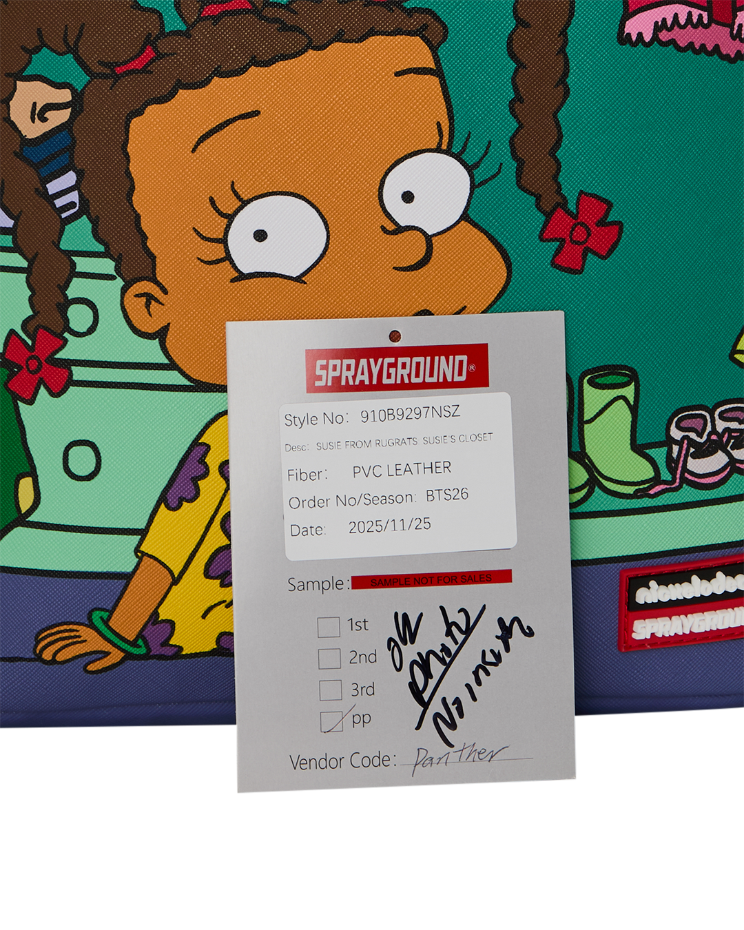 Sprayground product label card on mini backpack with fabric and style details