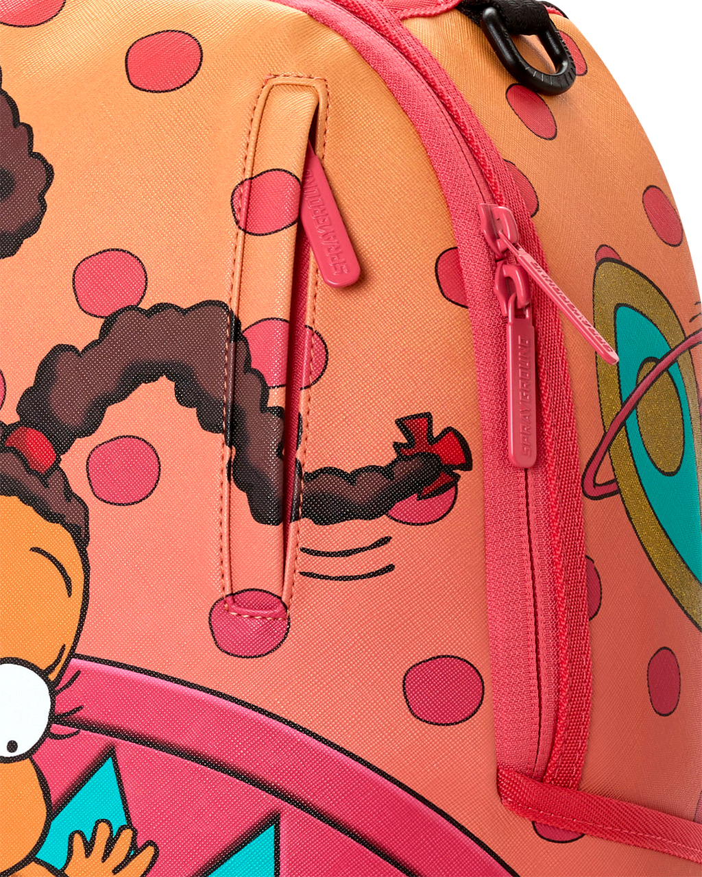 Sprayground mini backpack side close-up with pink zipper pull and character print.