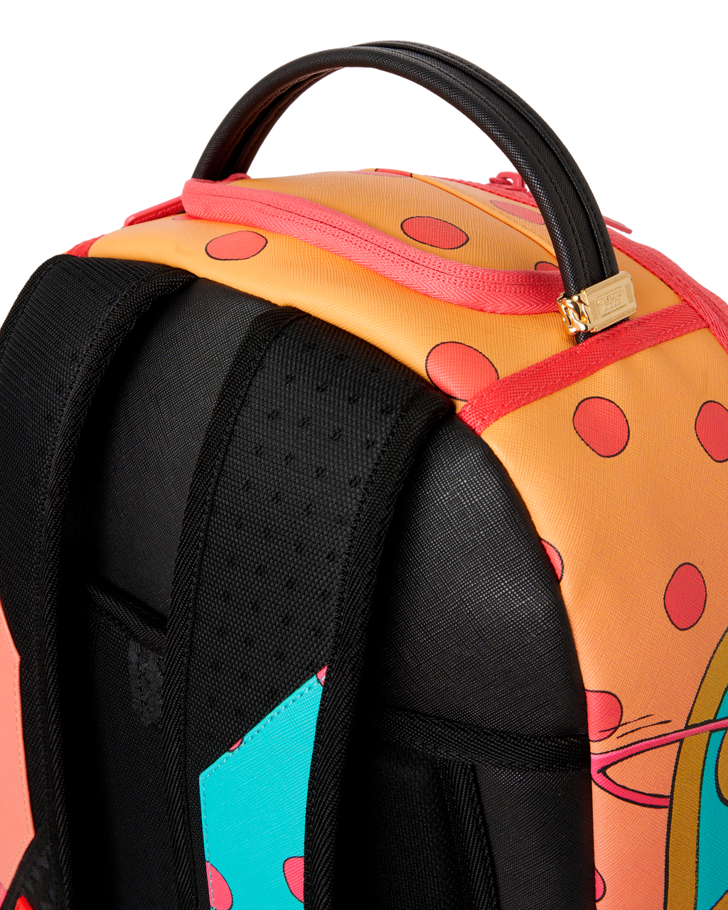Sprayground mini backpack side close-up showing black padded straps and orange top.
