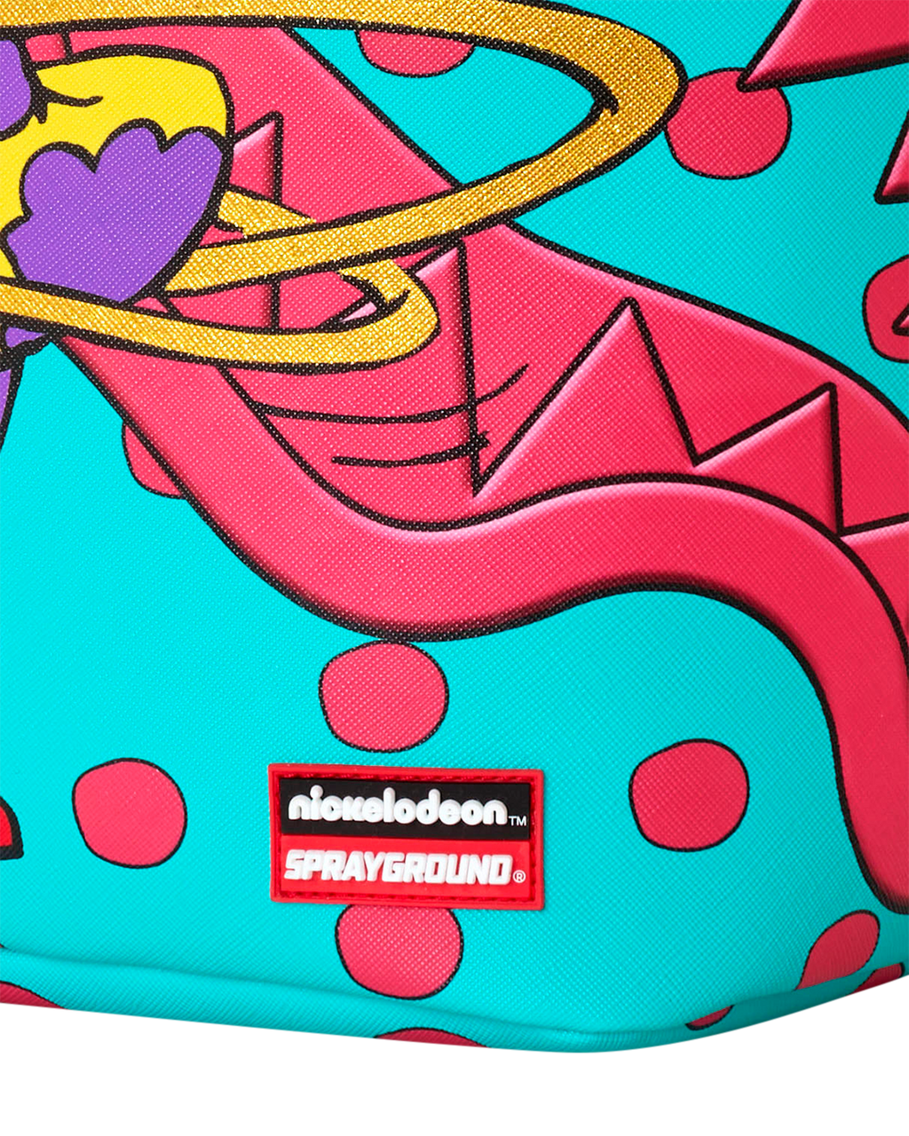 Sprayground mini backpack front close-up with niche logo patch and colorful graphic.