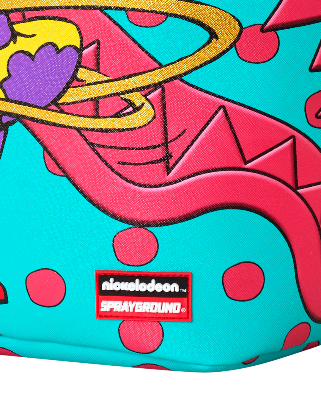 Sprayground mini backpack front close-up with niche logo patch and colorful graphic.