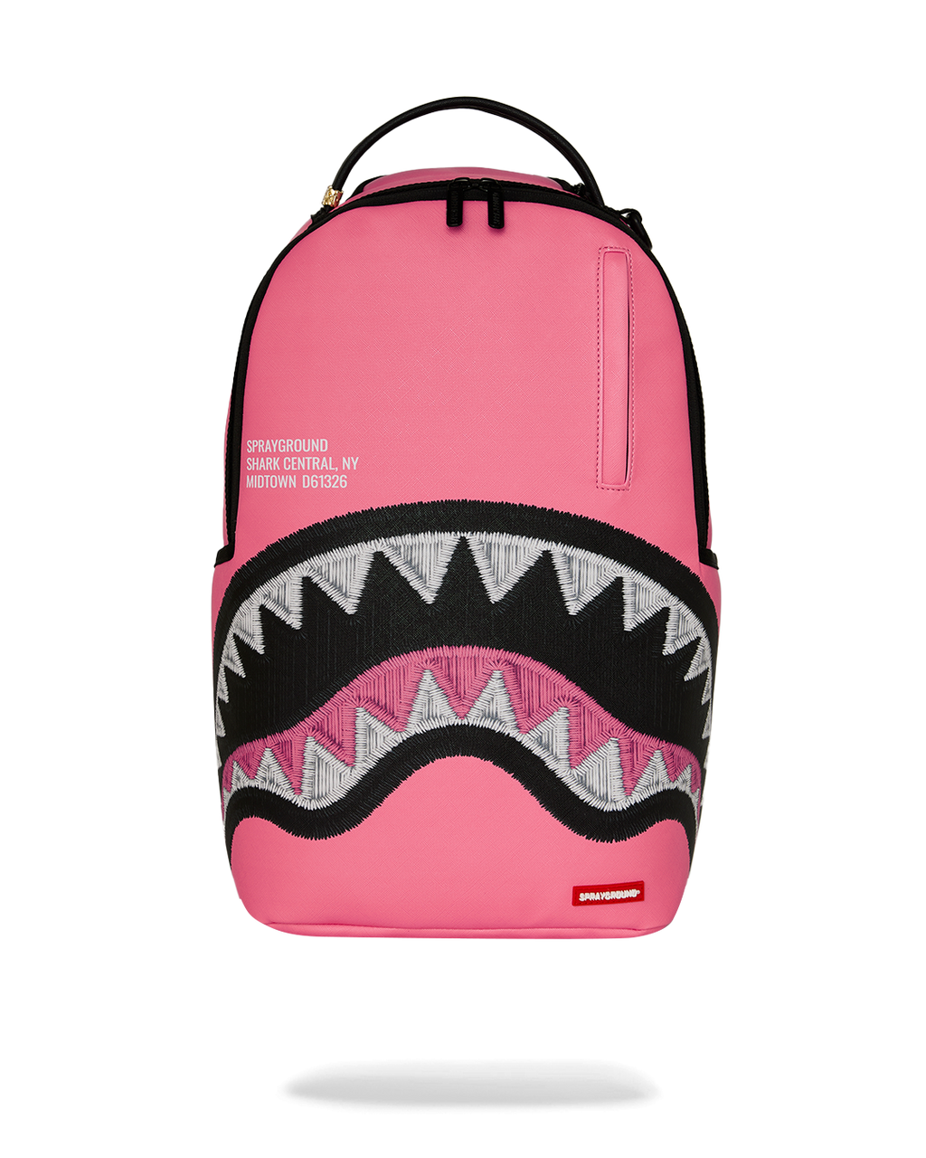 Pink backpack with black zigzag shark graphic front and top handle