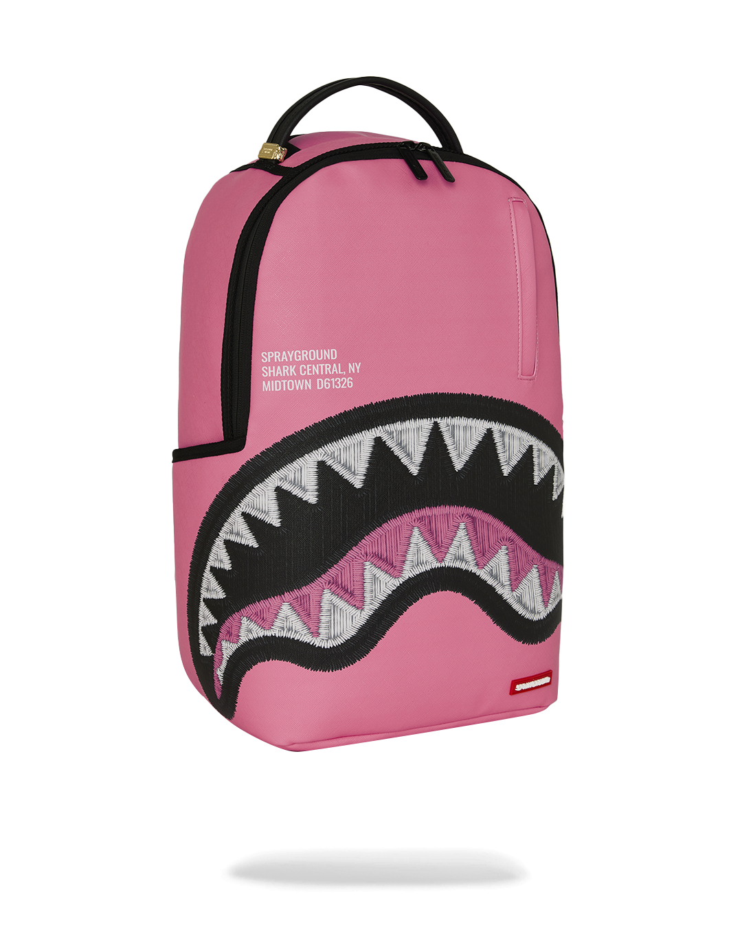 Pink backpack with top handle and black zigzag shark graphic panel