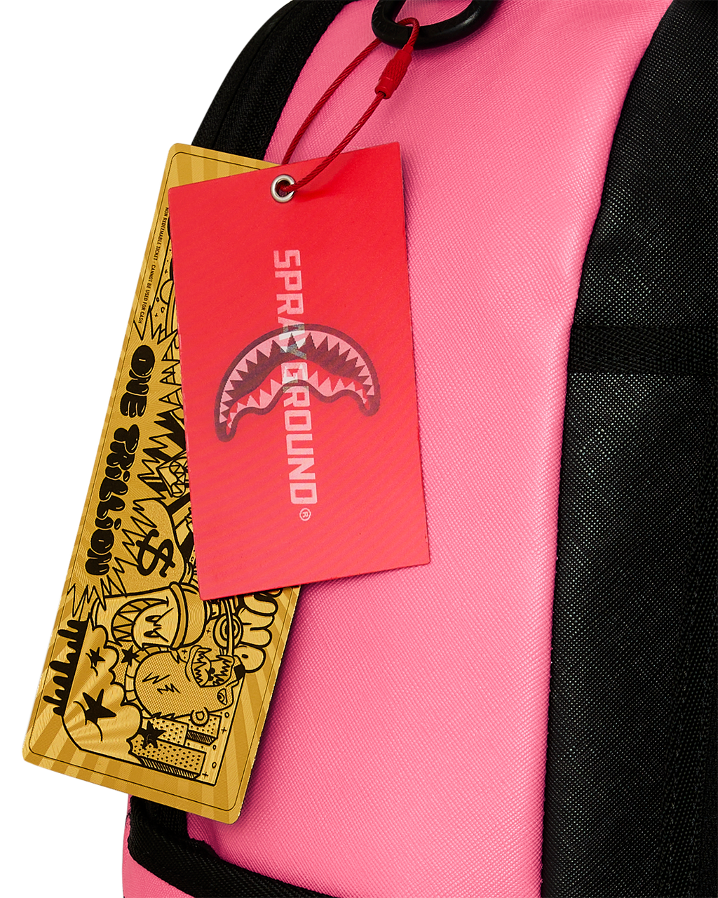Pink backpack with black strap and hanging product tags