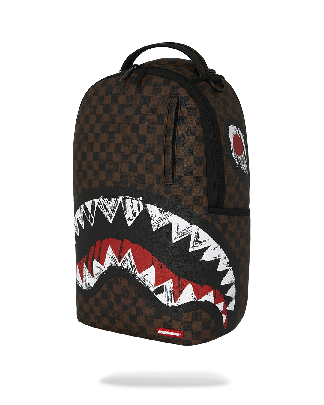 Sprayground backpack front view with brown checkered fabric and red/white shark graphic