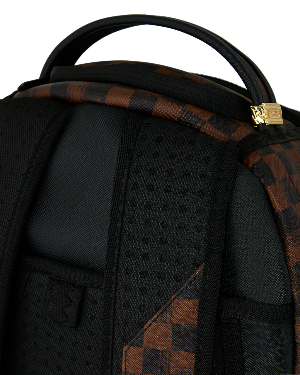 Sprayground backpack interior close-up with black padding and webbed shoulder straps