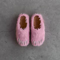 Pink faux-fur bear claw mules with open toe and grippy sole