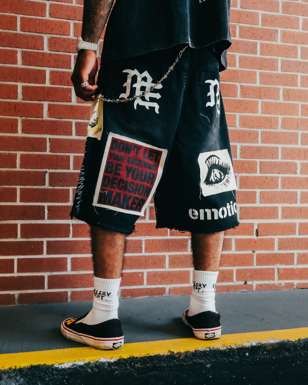 Men's black graphic carpenter shorts with Dont let be your decision maker patch