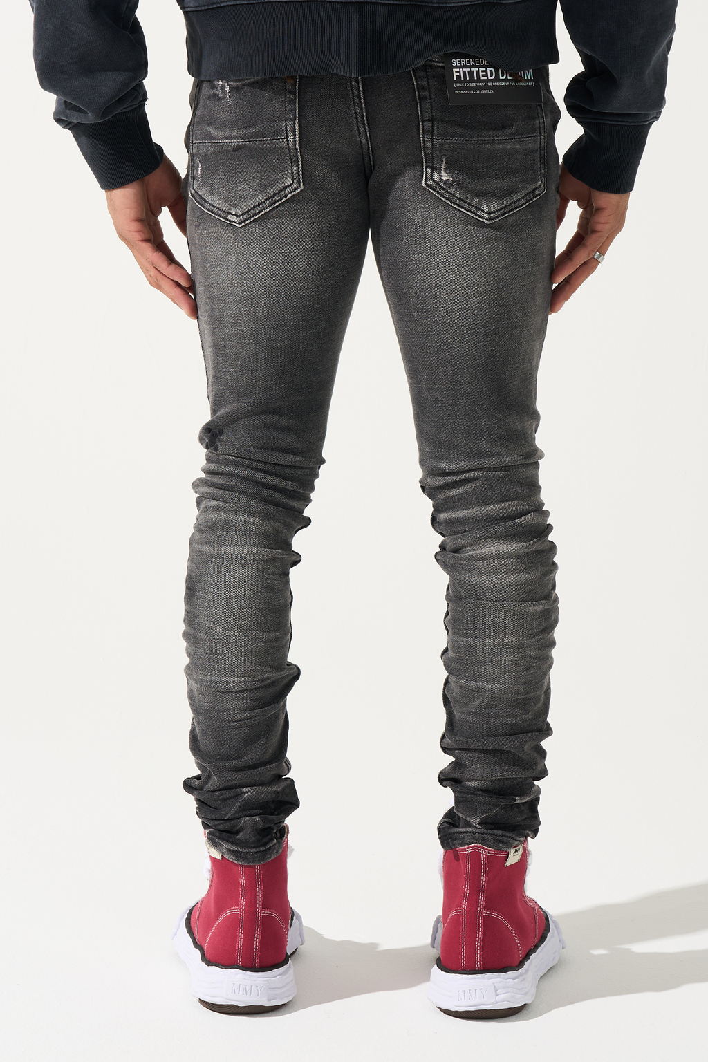 Men's slim-fit jeans in dark gray wash with back pockets and stitched seams