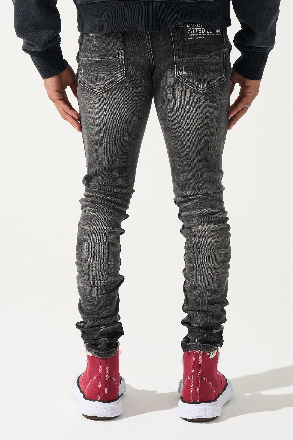 Men's slim-fit jeans in dark gray wash with back pockets and stitched seams