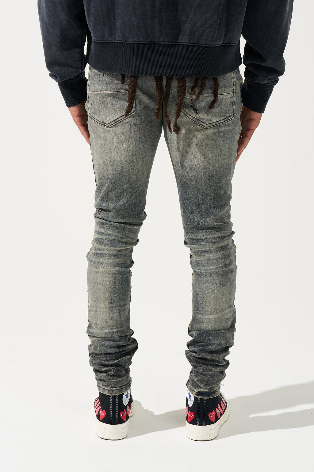 Men's gunmetal-wash slim jeans, back view, ruched ankle cuffs and two back pockets